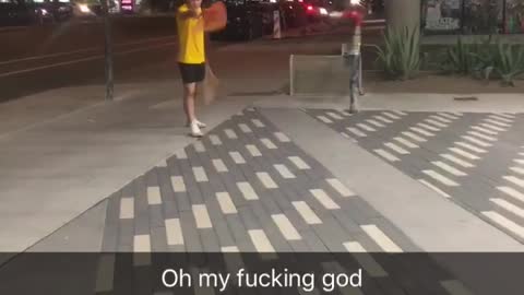 Man in yellow lands on sign