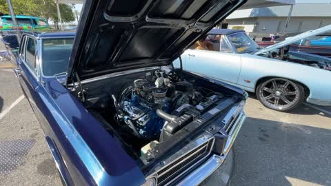 Car show including Corvairs and Cougars
