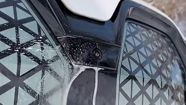 It's a cool trick from BMW to clean the camera