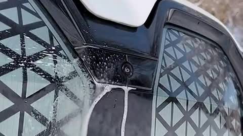 It's a cool trick from BMW to clean the camera