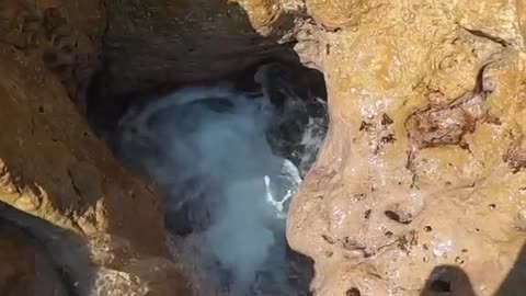 Hole in Rocks by the Sea Turns into Underwater Tunnel