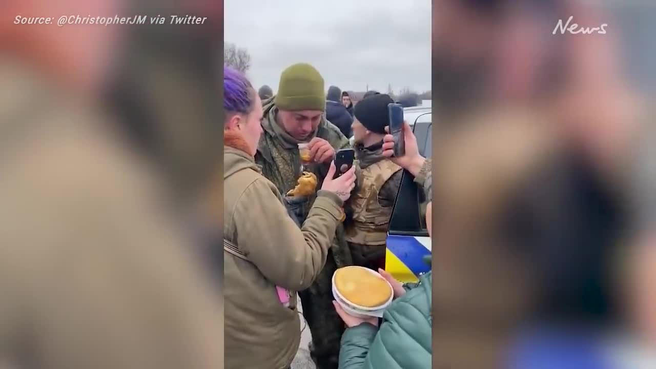 Russian given food and tea by ukrainians