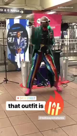 Man in a green blazer dancing and singing in subway