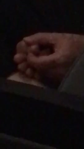 Person has foot in hand on train