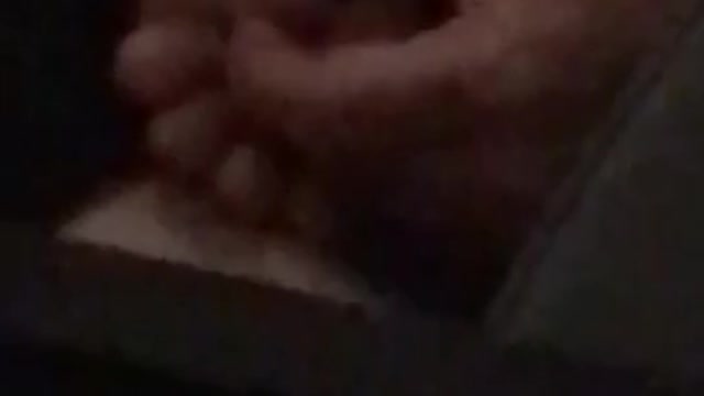 Person has foot in hand on train