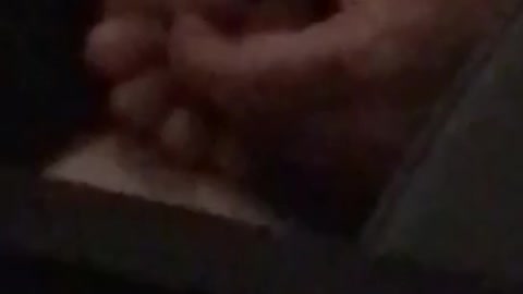 Person has foot in hand on train
