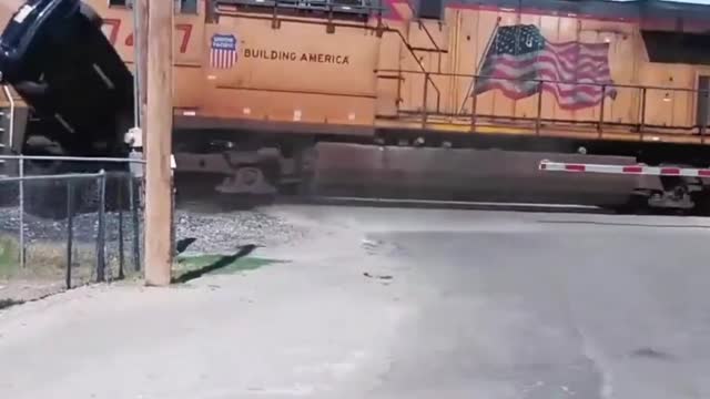 Train hits car off of trailer
