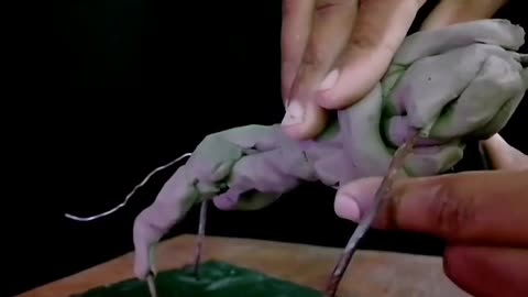 The whole process of making a bull in clay