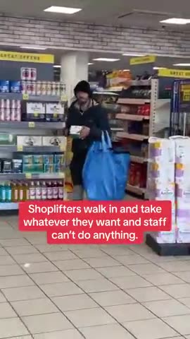 Shoplifters in Tesco, UK. Shoplifters walk in and take whatever they want and staff can't do anythin