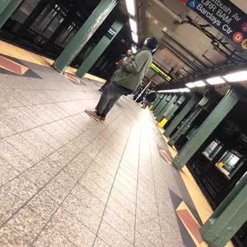 Headphones guy dancing in subway terminal