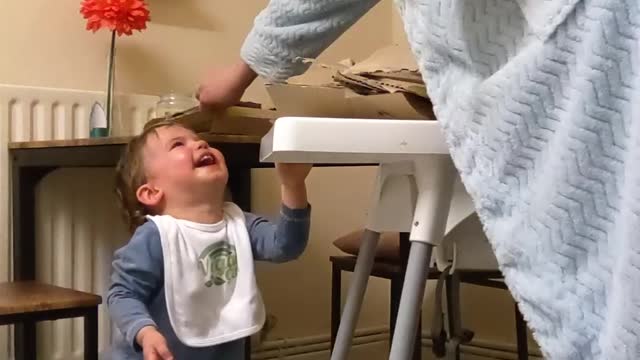 Baby Delighted By Recycling