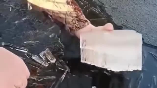 Satisfying video of ice being removed from water