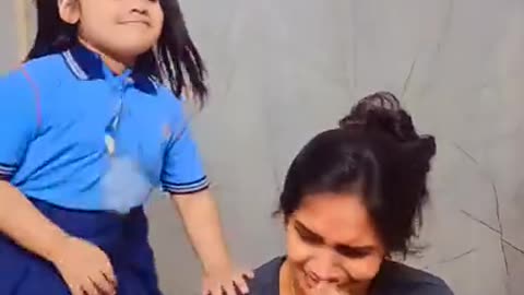 Mother felling and daughter enjoying