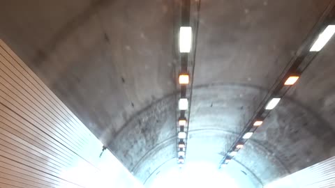 In a car driving through a tunnel.