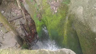 Crossing a little waterfall on the trail