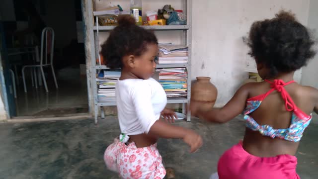 My twin babies are trying to dance.