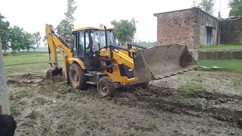 JCB machine into the mud.