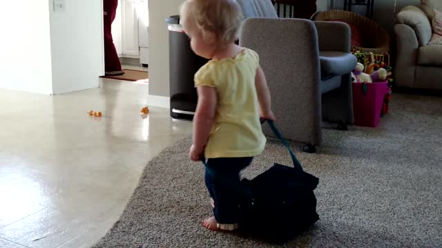 Baby Girl Takes Daddy's Lunch Bag