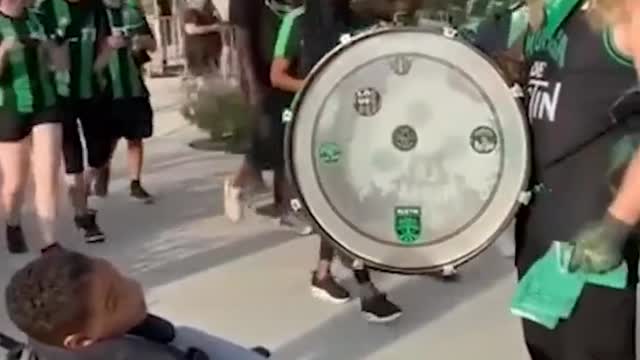 The fan band met a boy in a wheelchair before the game. After a brief conversati