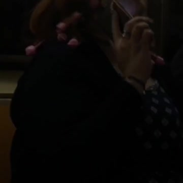 Woman has pink rollers on hair