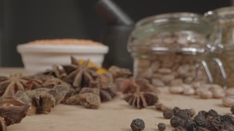 Extreme Close Up Tracking Out Shot of Spices and Grains on Table