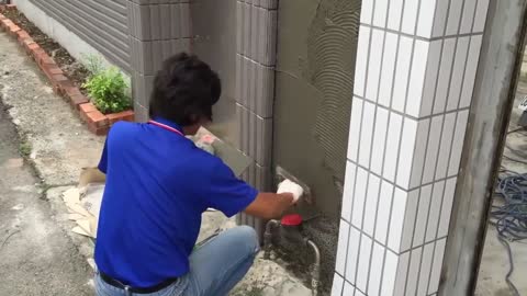 Beautiful plaster of the facade under stones and stones