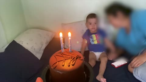 Boy Kicks Birthday Cake