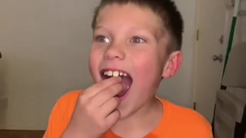 My 7yo trying an atomic warhead (sour candy)