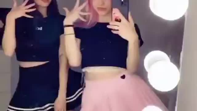 Two Beautiful Girls Dancing In Front Of The Mirror