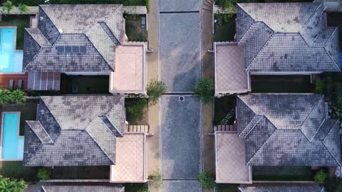 Flying over houses with drone filming in 4k