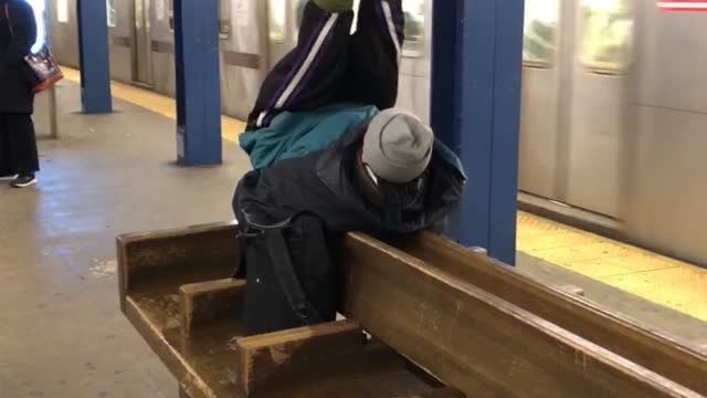 Red shoe guy does ab workout situps on wood subway bench