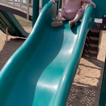 My Adorable Granddaughter Enjoying A Slide