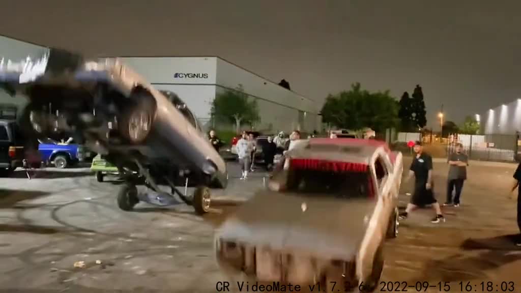 Two cars doing push-ups