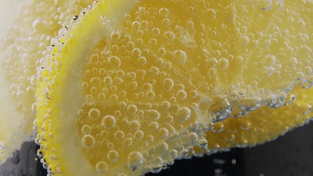 Lemon in cocktail effect macro shot