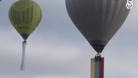 Ukraine flags fly from hot air balloons in Lithuania