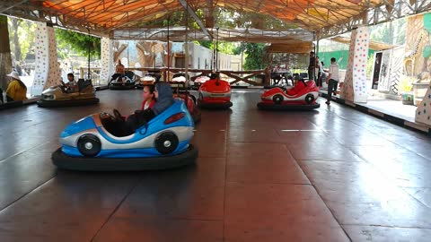 Funny Electric Kids Cars In Park