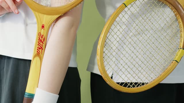 Couple Holding a Rackets