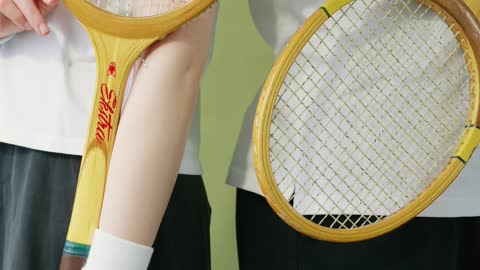 Couple Holding a Rackets