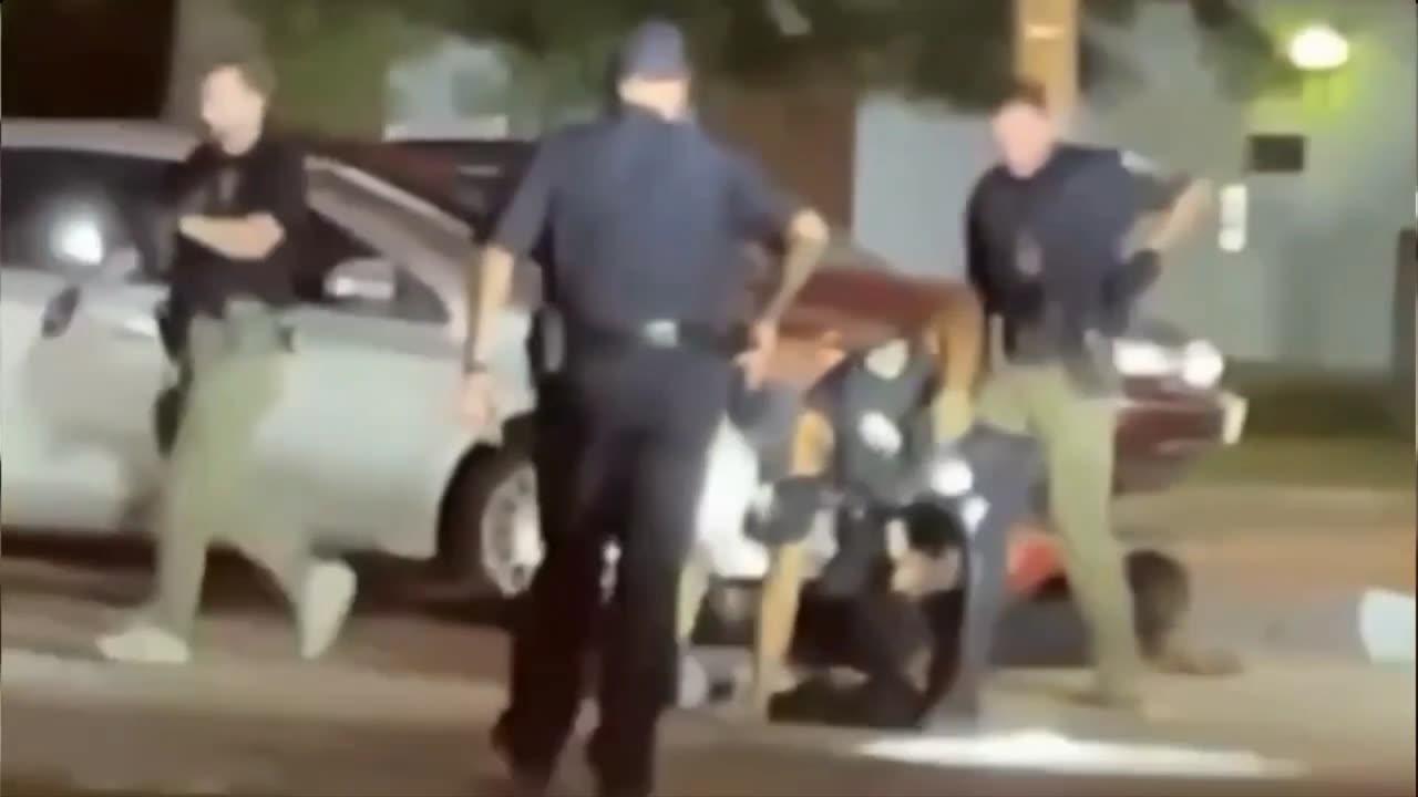 Man kneeling on ground with hands up was kicked in chest by cop