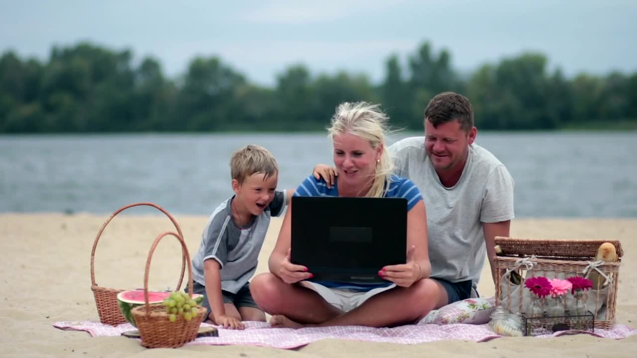 Picnic at the beach with a laptop