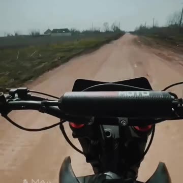 Russian soldier on a motorcycle records a Russian SU-25 flying low
