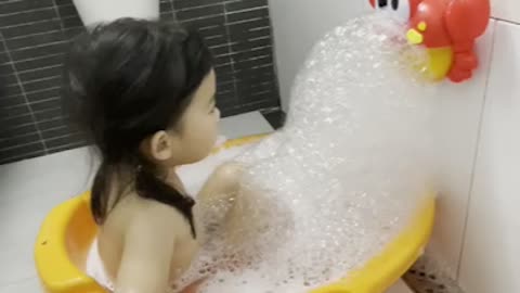 Baby take a shower with bubble