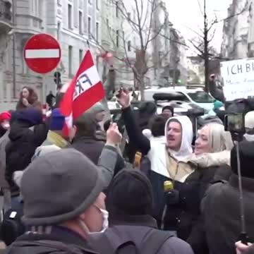 Protesters broke down police barriers in Vienna on Saturday as they decried the COVID