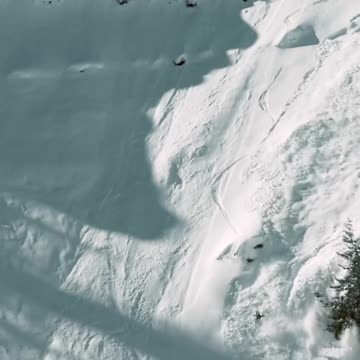 Skiing down the snowy mountain slope of avalanches