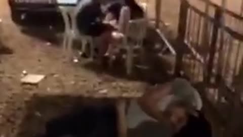 Guy purple shorts on ground drunk