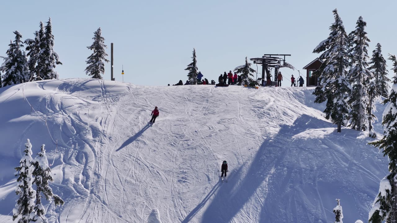 Skiers on a snowy slope