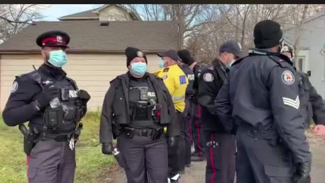 97 Toronto Police Stand to Prevent business from Opening