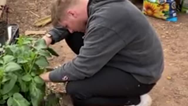 Cat wraps her arms around her dad's neck to hug him