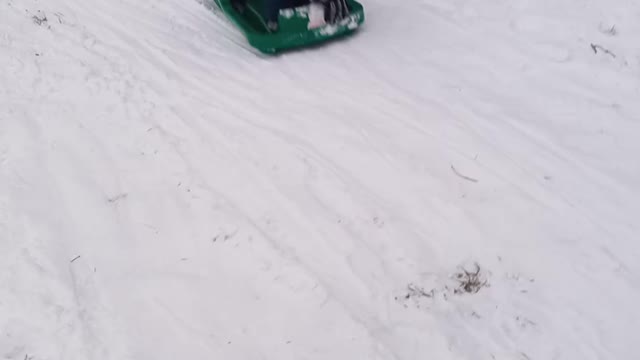 Snow boarding on a sled 2