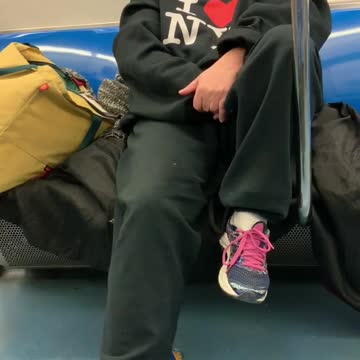 Lady talks to herself on subway train, "get outta here"